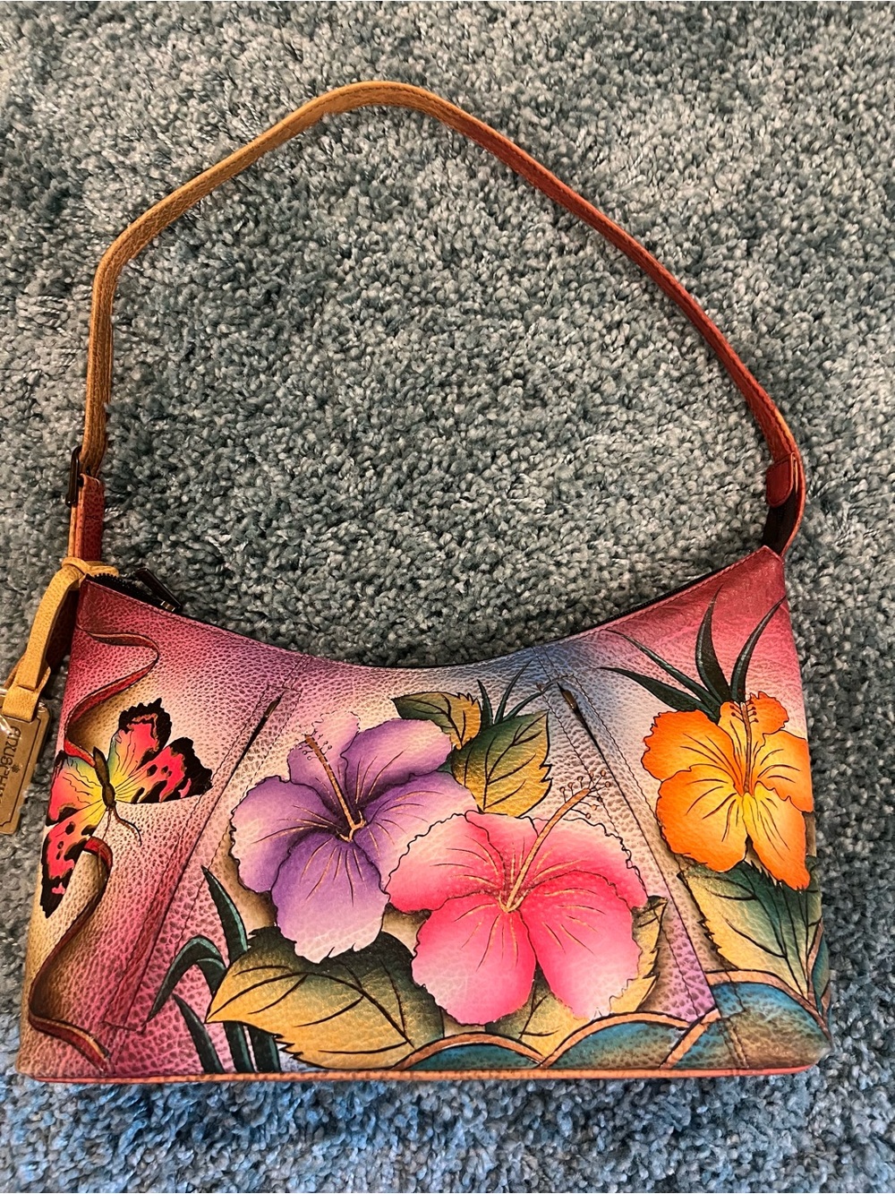 This is an authentic Anuschka handbag